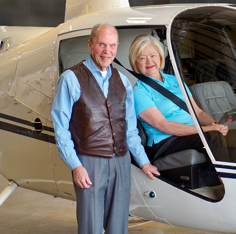 Ray and Linda Booker in a helicopter