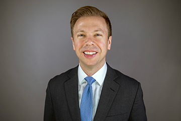 Spears Business assistant professor Dinkel wins research awards for legal ethics papers