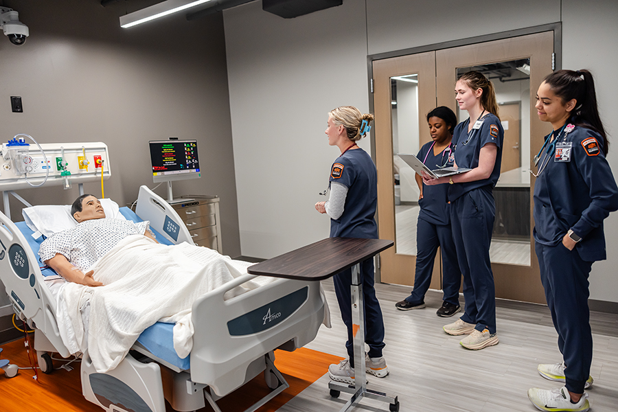 Nursing students and instructors in the lab