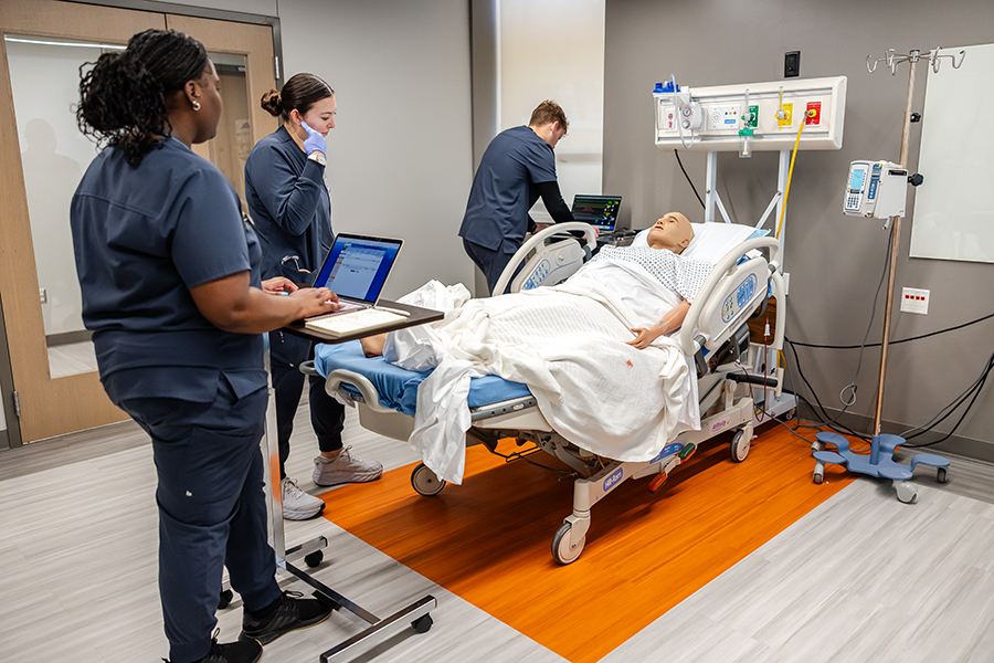 Nursing students and instructors in the sim lab