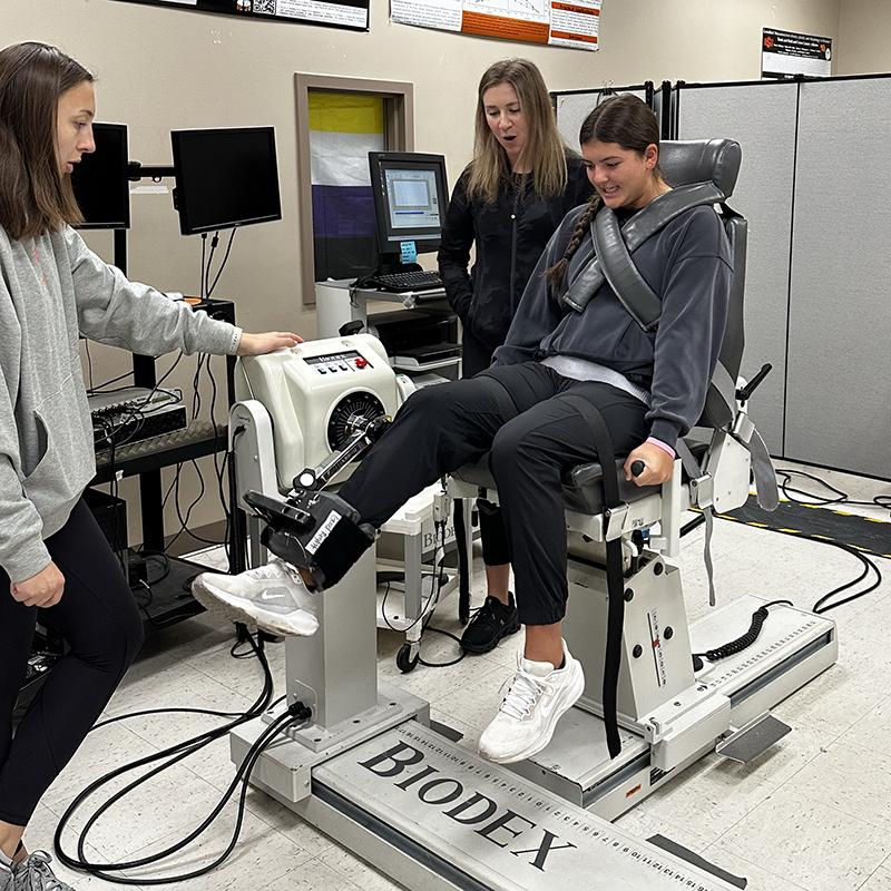 Golfers in the lab using the Biodex machine
