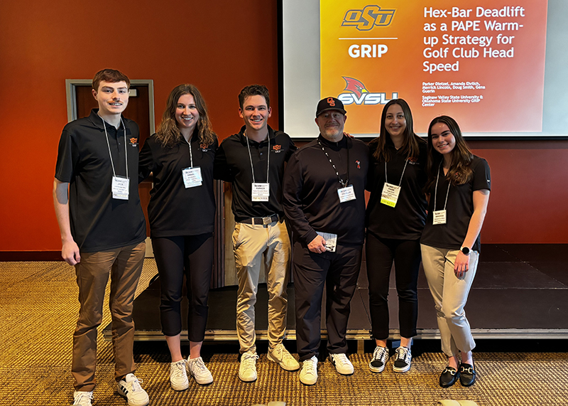 Doug Smith and students at a conference