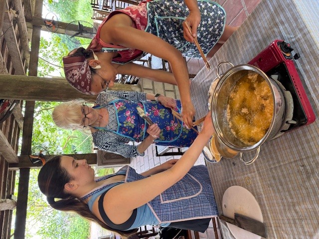Students cooking outside in Vietnam
