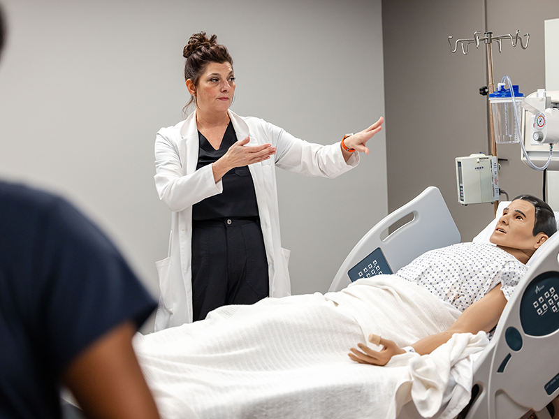 OSU nursing student in clinic with simulated patient