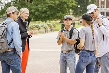 President Shrum with students